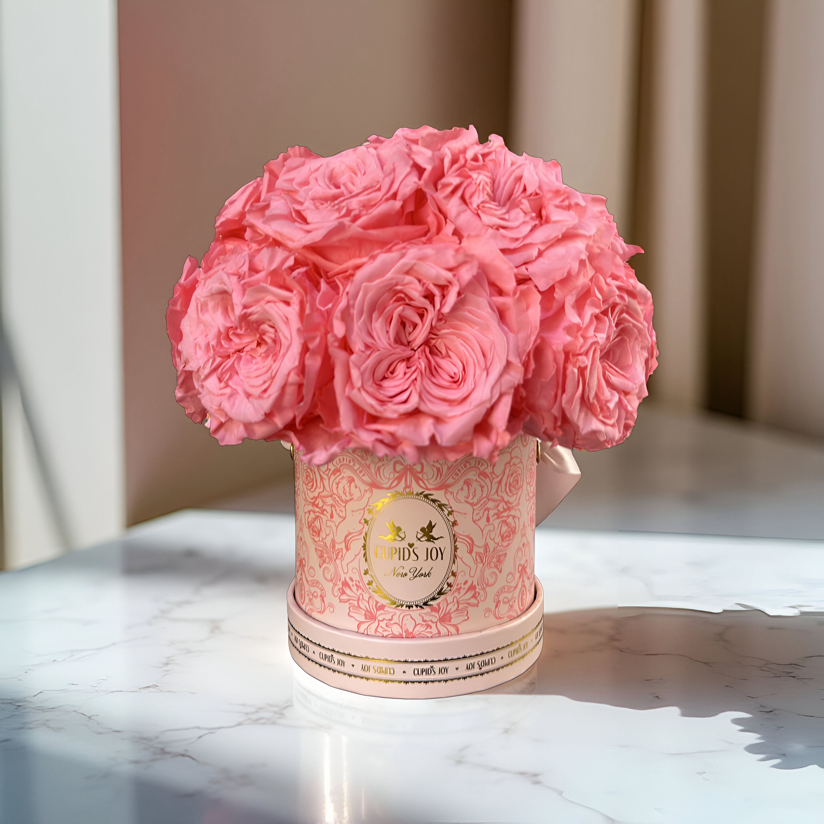 Light Pink eternal bouquet of roses in a flower box on a marble surface