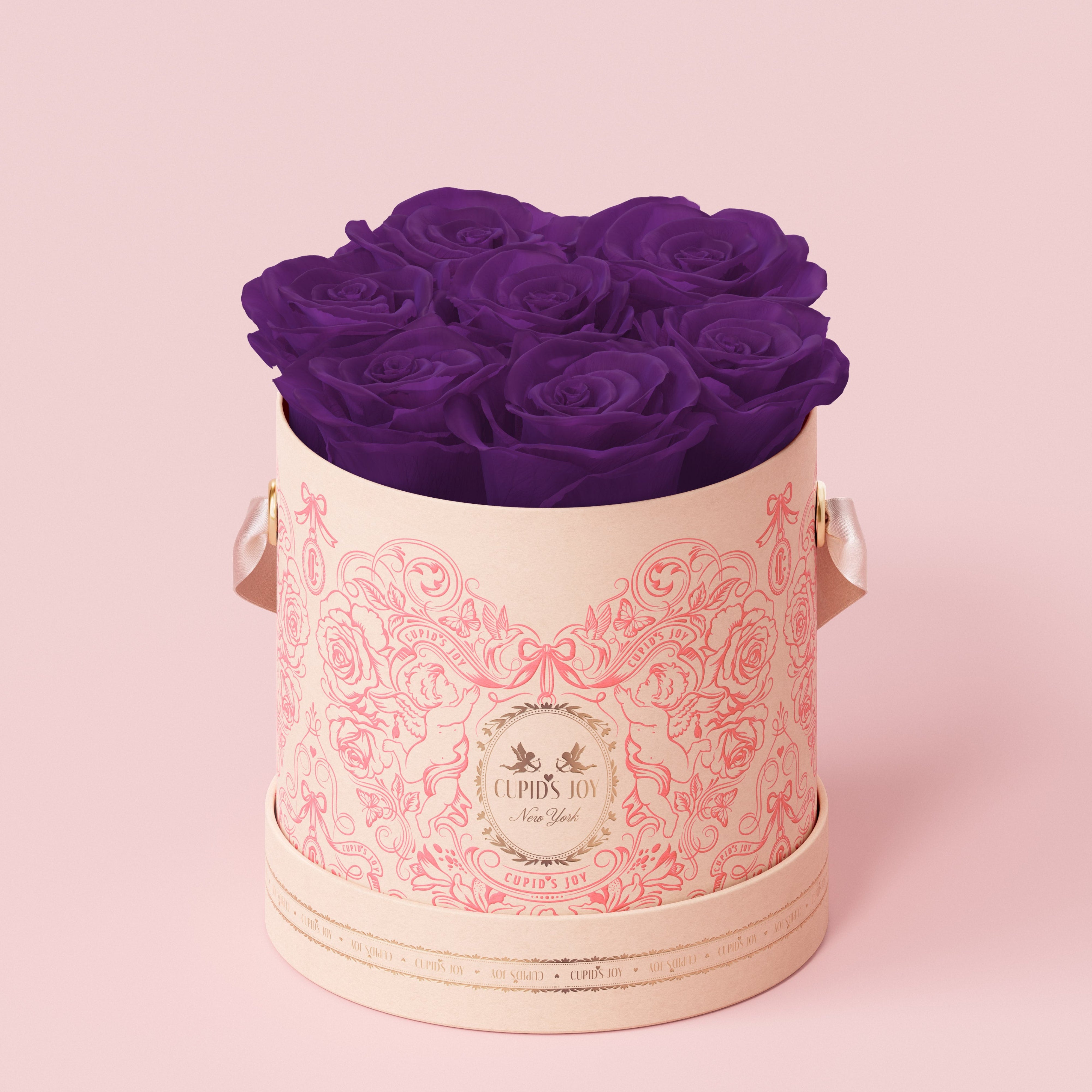 Maison Cupid Decorative box with purple preserved roses on a pink background