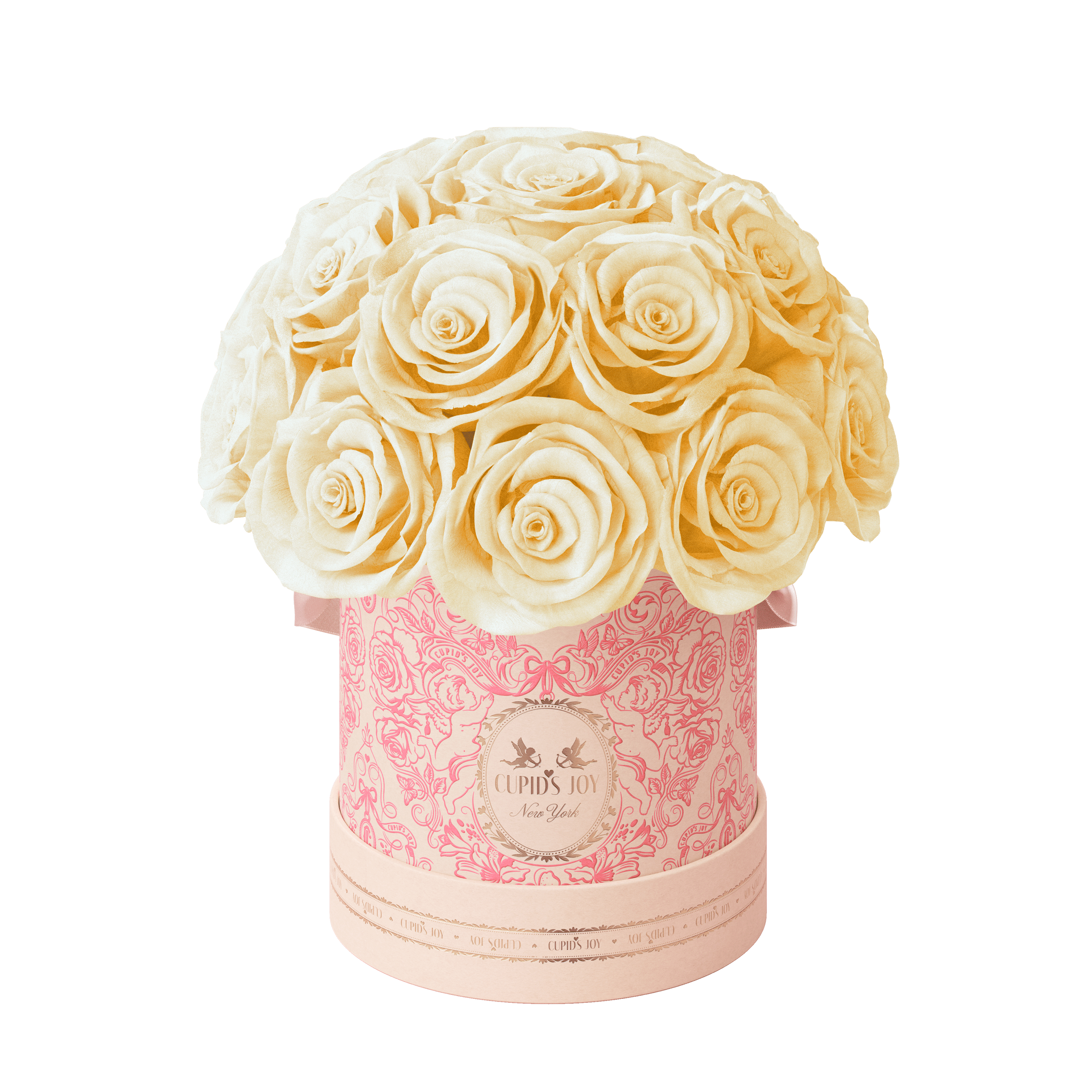 A bouquet of preserved cream-colored roses arranged in a round pink patterned box with a lid, photographed on a plain white background.