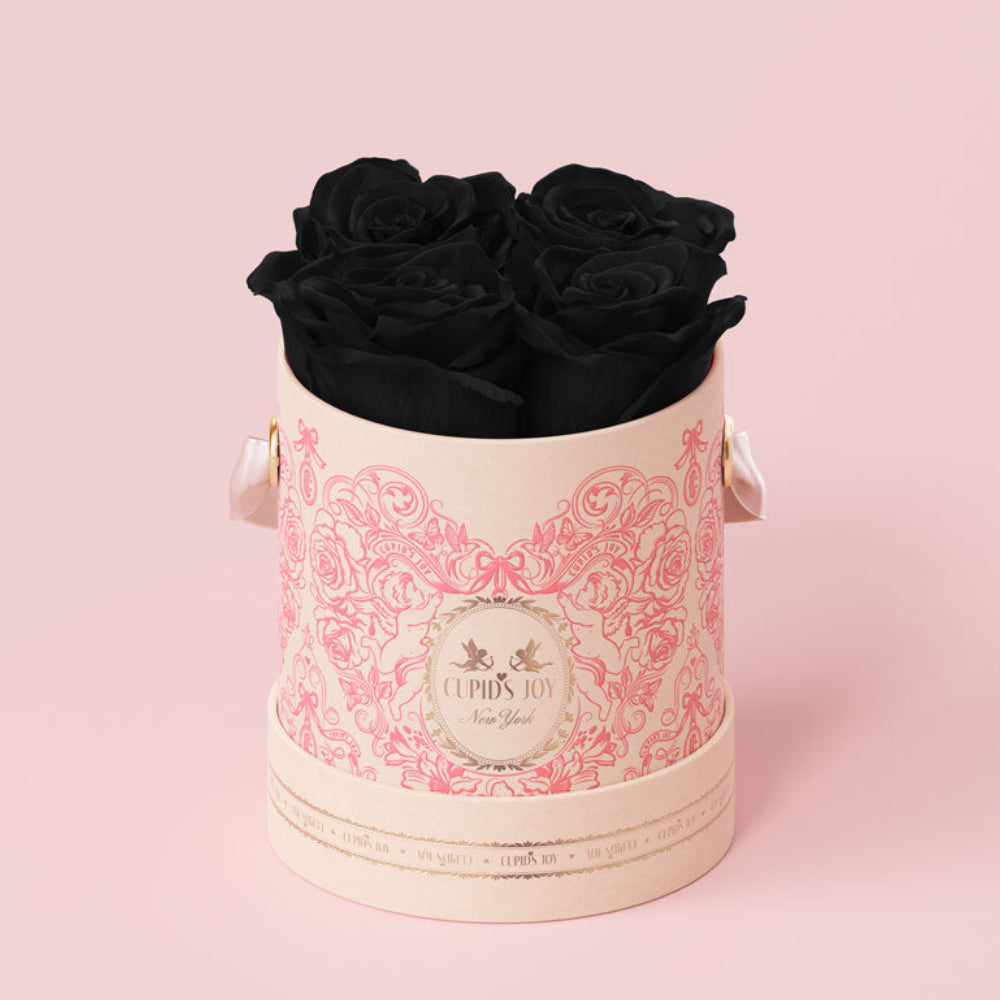 Pink floral box with black roses on a pink background